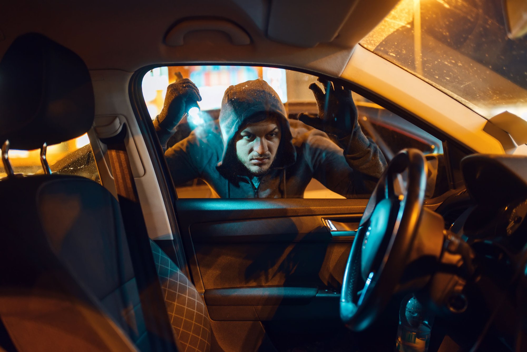 man preparing to break into car